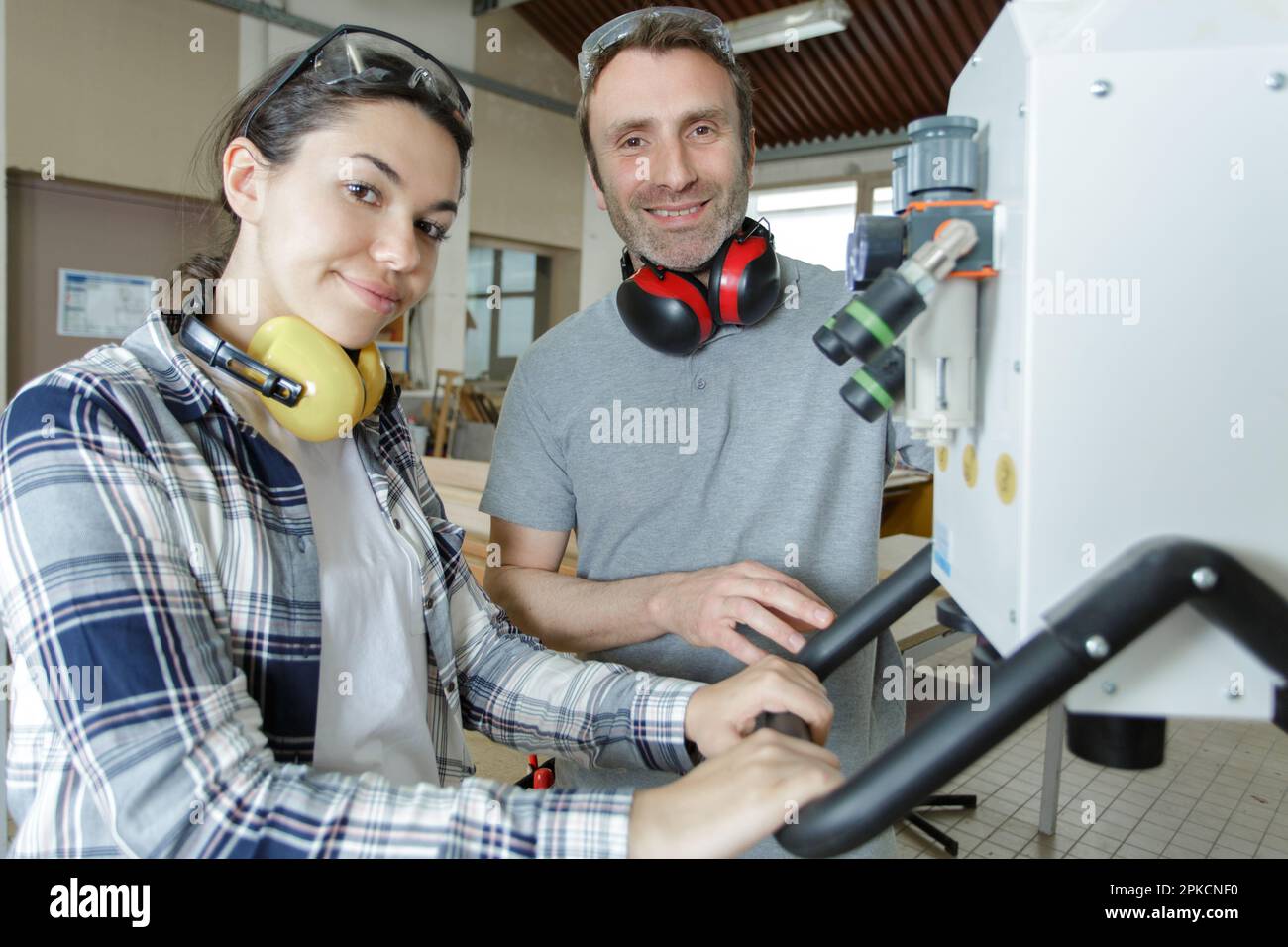 female engineer quality controlling components in factory Stock Photo