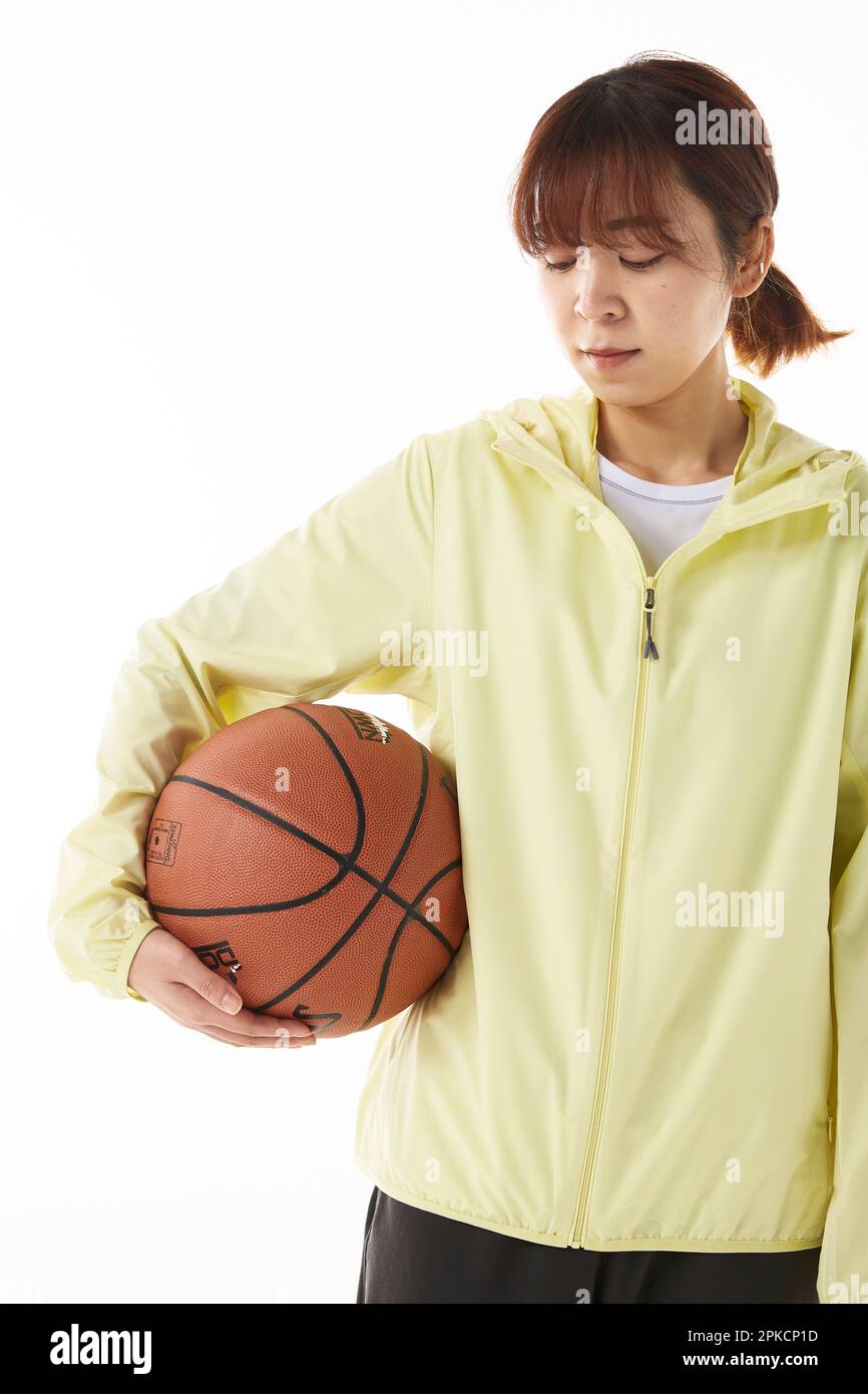 Woman Holding Basketball Stock Photo - Alamy