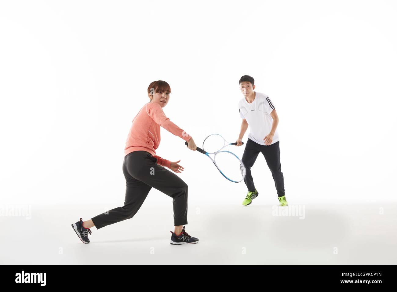 Men and women holding up rackets in tennis doubles Stock Photo Alamy
