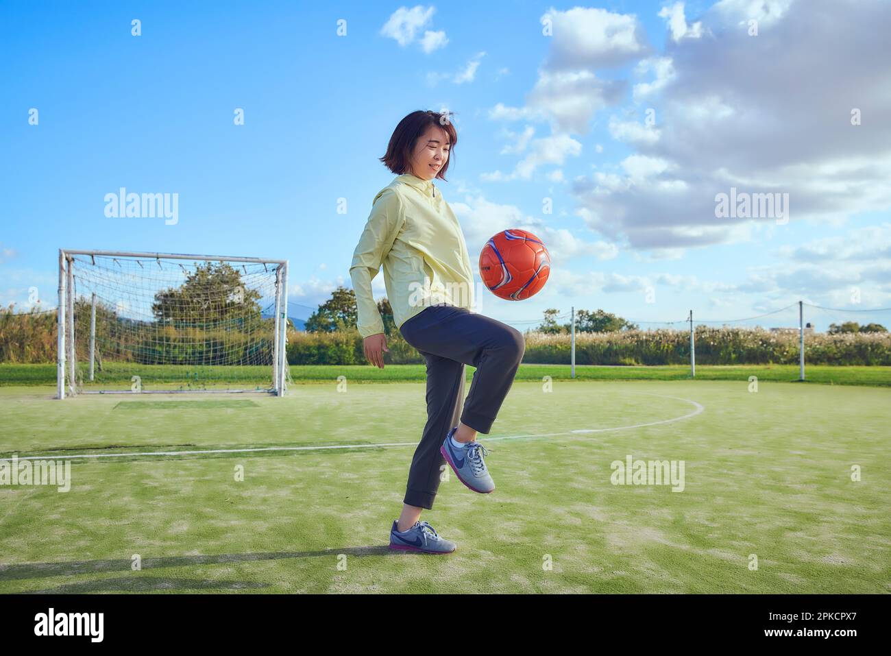 Female soccer player lifting the ball Stock Photo Alamy