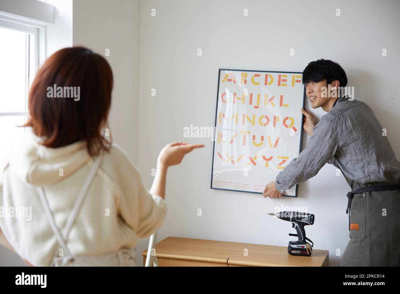A man and a woman deciding where to place a forehead Stock Photo
