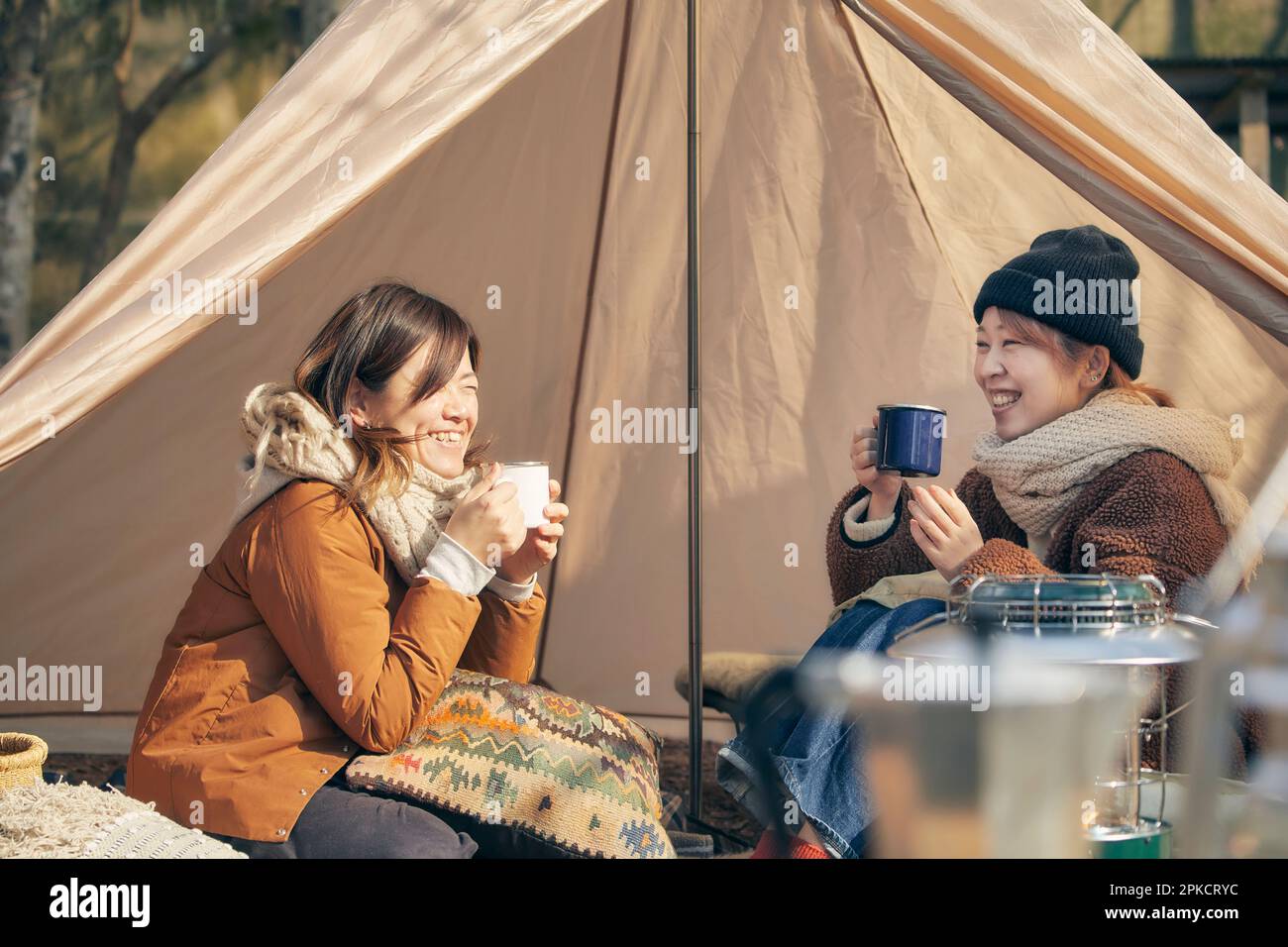 Two women camping in a winter campsite Stock Photo Alamy