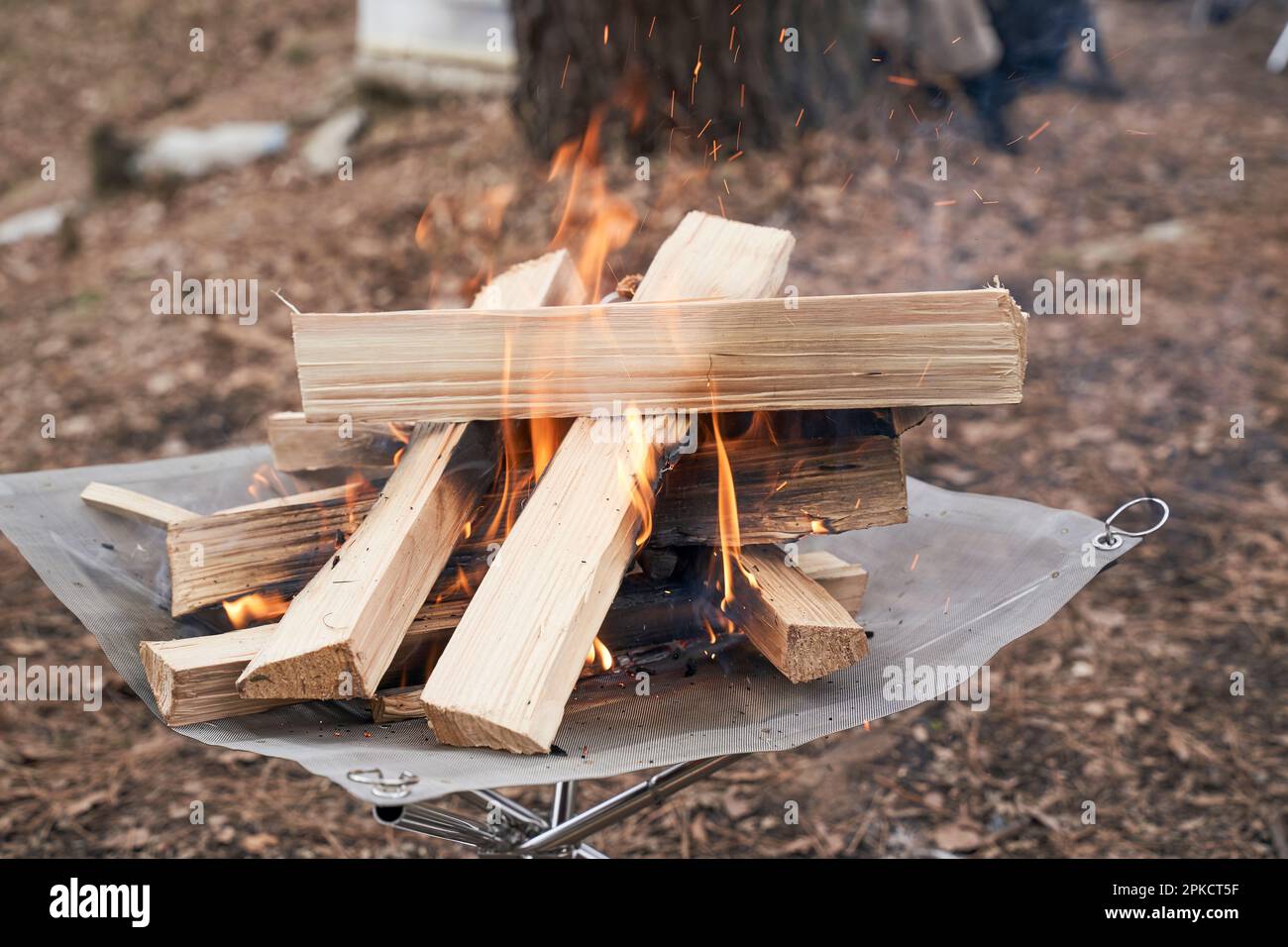 Building a fire in a fire pit Stock Photo Alamy