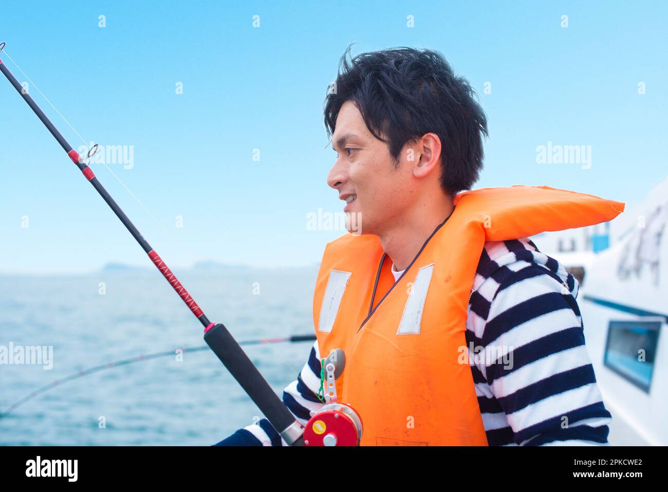 Young japanese man fishing hi-res stock photography and images - Alamy