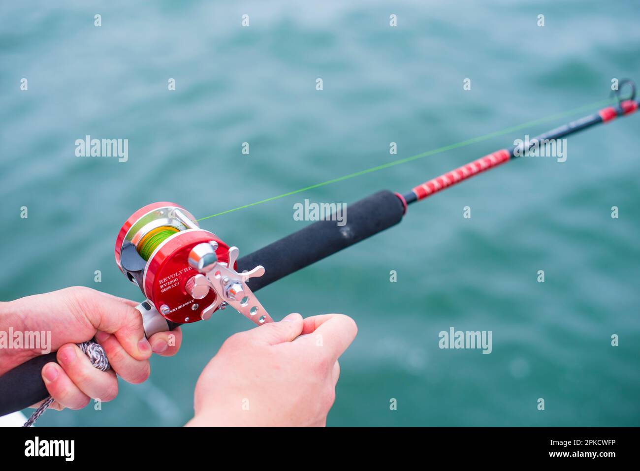 Holding a fishing rod hi-res stock photography and images - Alamy