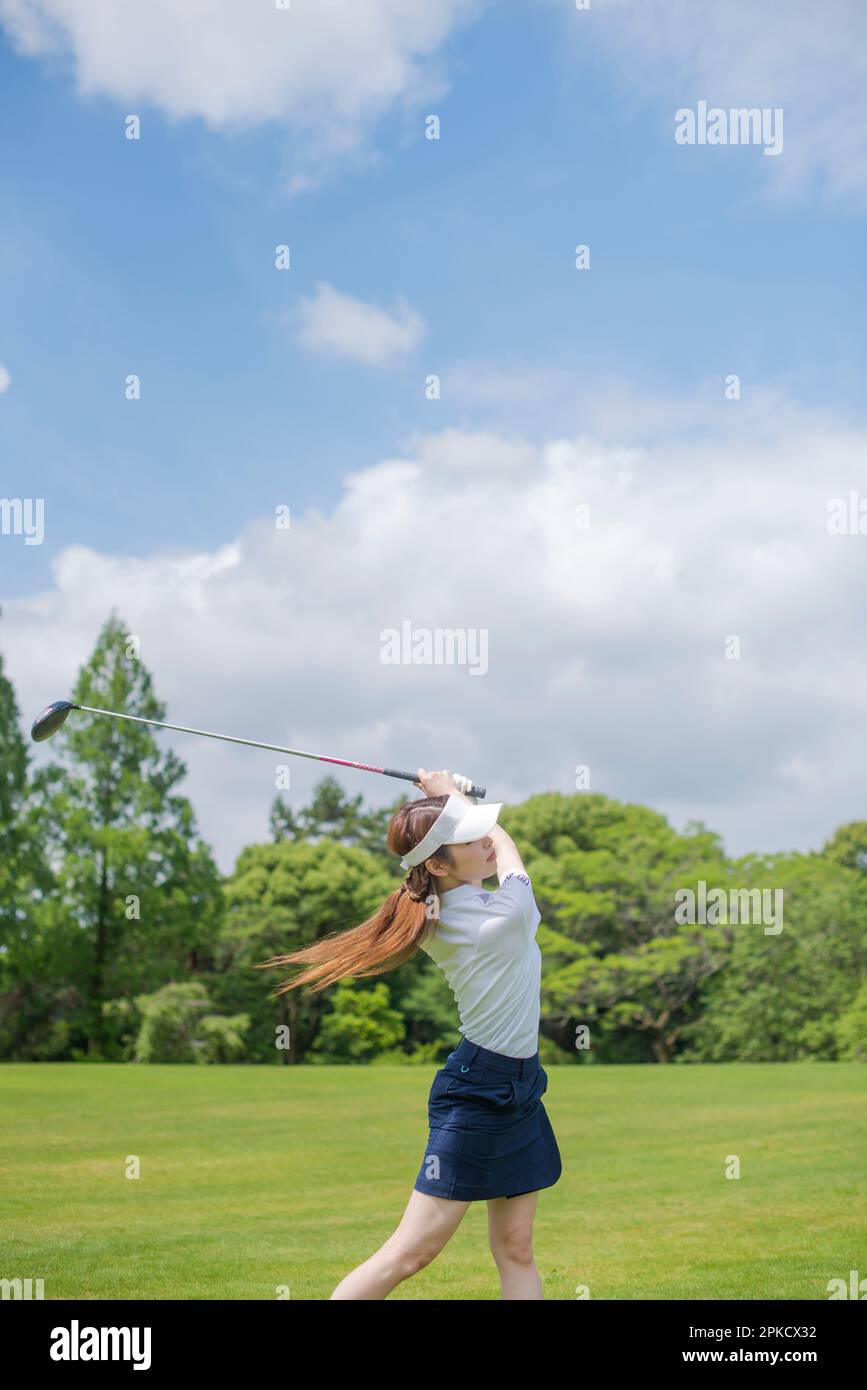 Women in their 20s who play golf Stock Photo