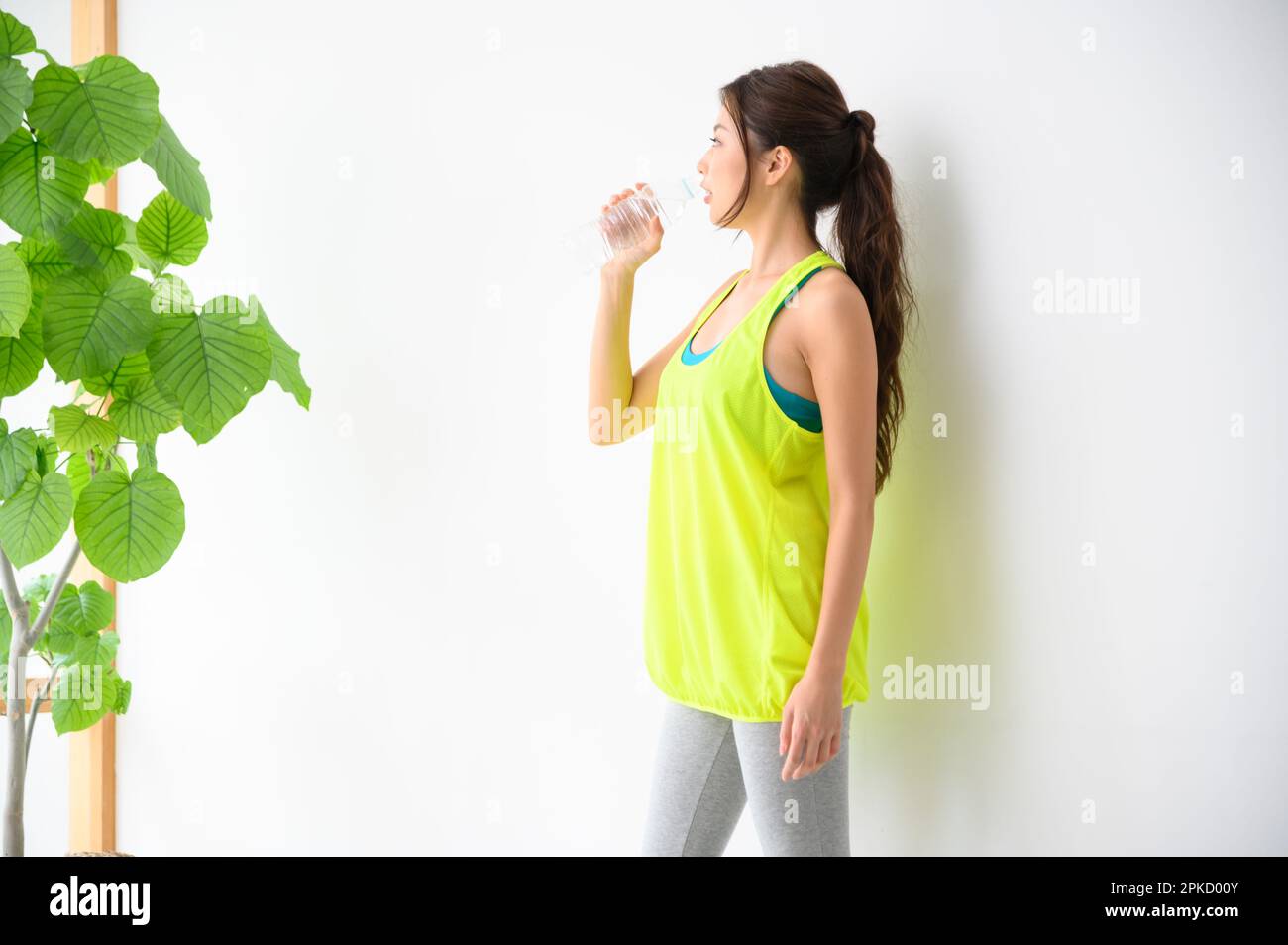 Woman Drinking Bottled Water Stock Photo