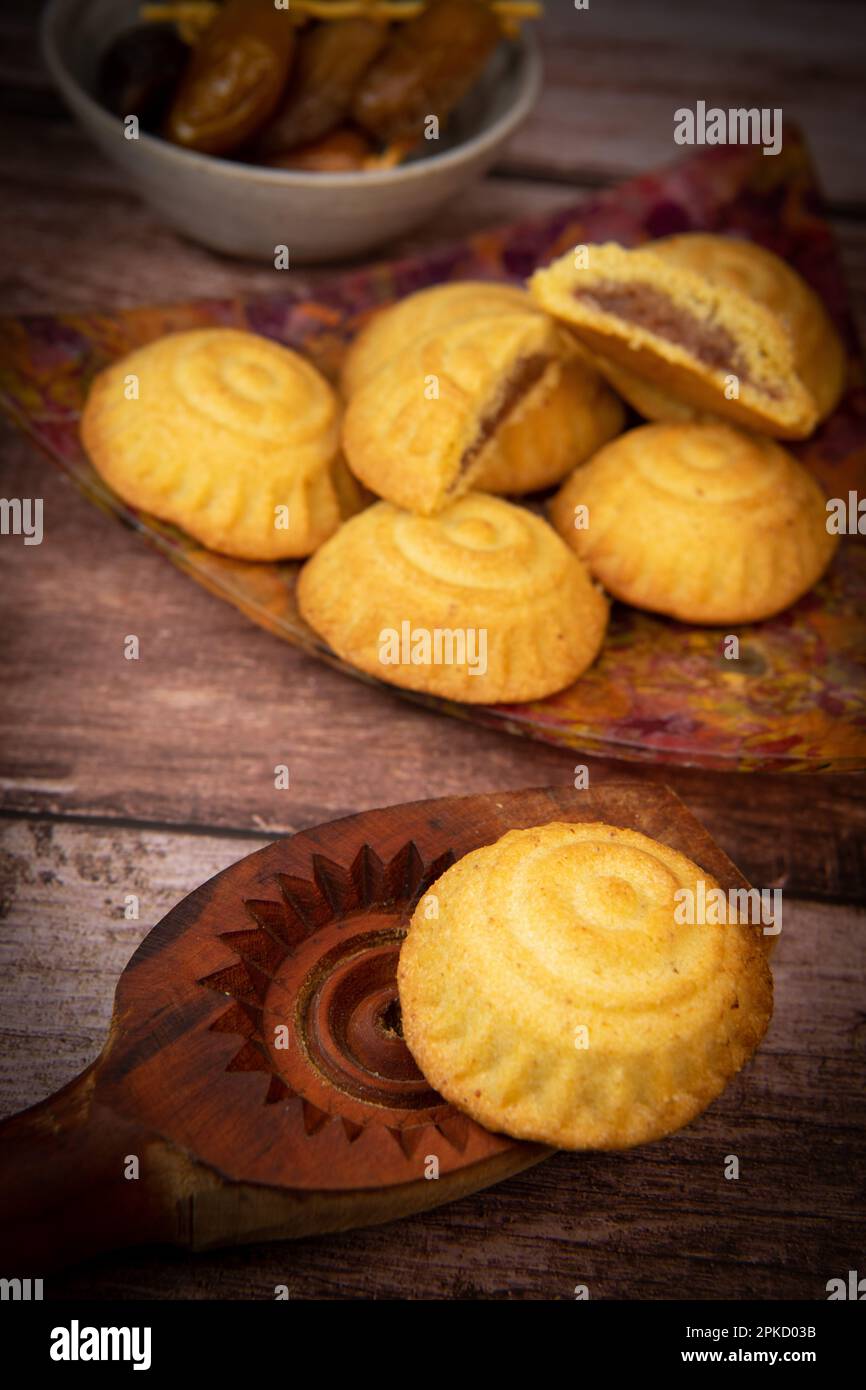 Traditional eid maamoul or mamoul cookies with dates, nuts, and jam, Arabic sweets for Aid al