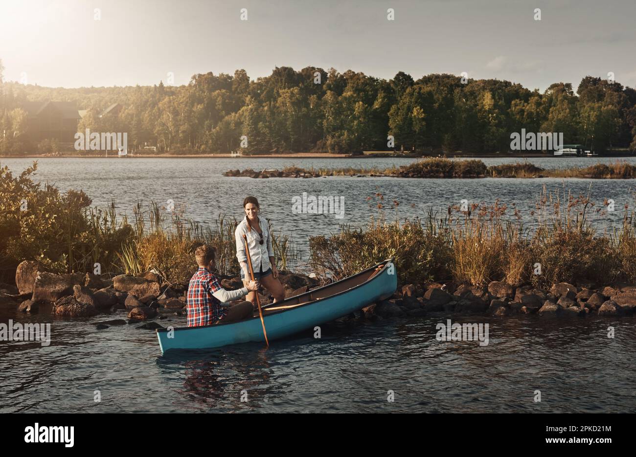 Kayaking for two. a young couple going for a canoe ride on the lake ...