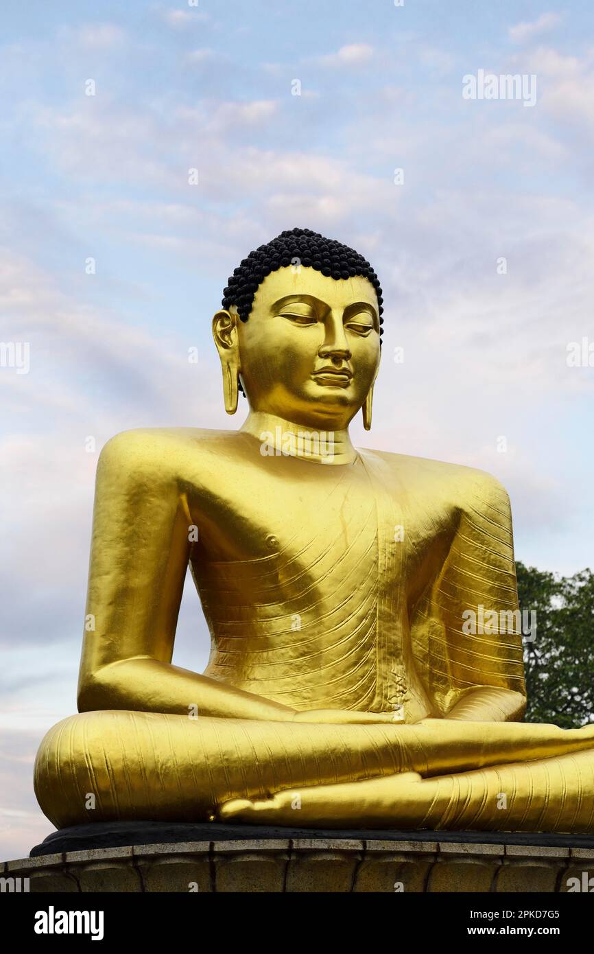 Golden Buddha statue in Viharamahadevi Park in the centre of Colombo, Cinnamon Gardens, Sri Lanka Stock Photo