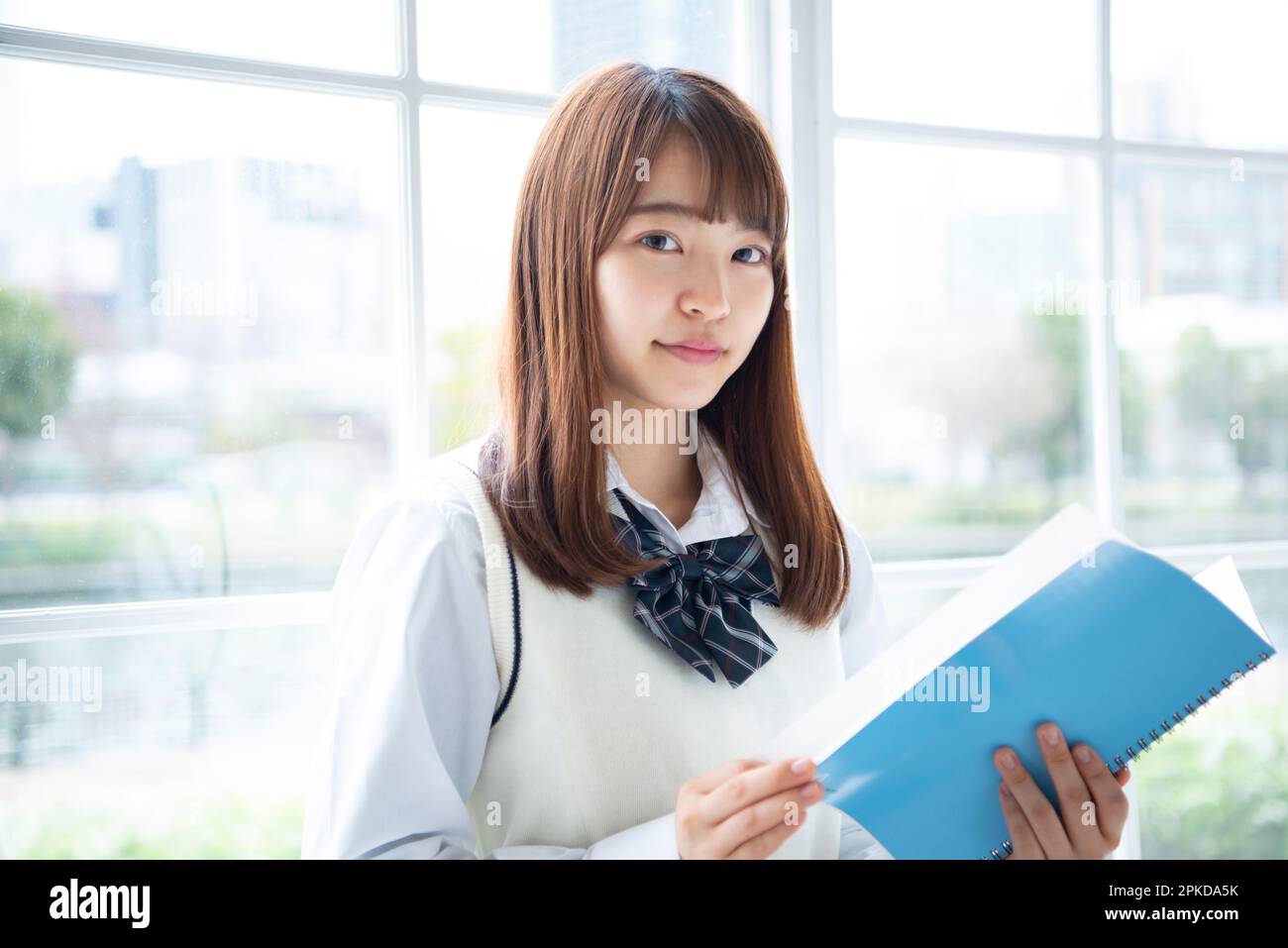 High school girl with notebook Stock Photo - Alamy