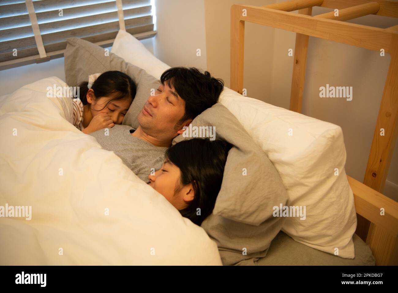 parent-and-child-sleeping-in-bed-stock-photo-alamy