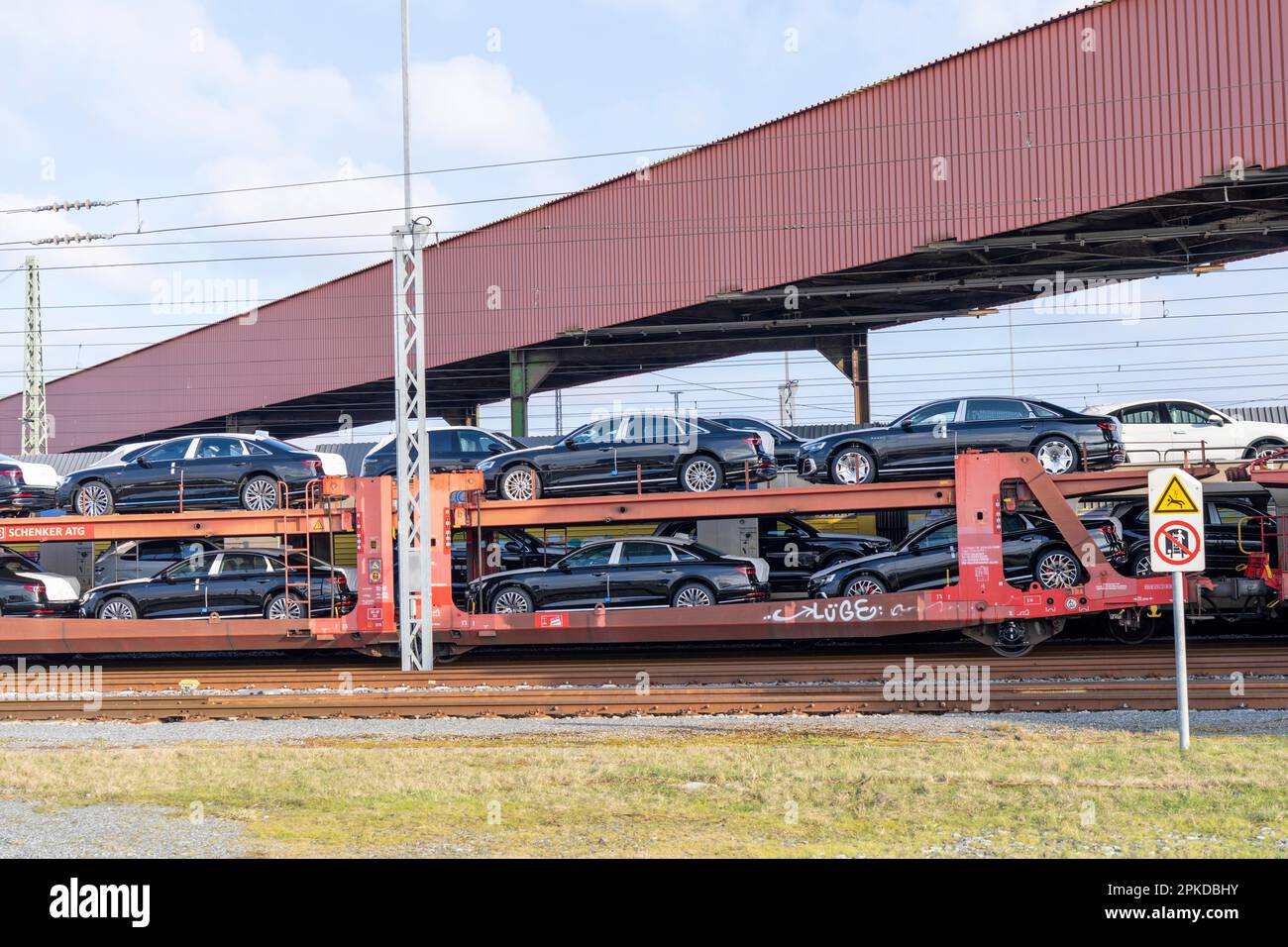 Car train, goods train on its way to the car terminal in the seaport of