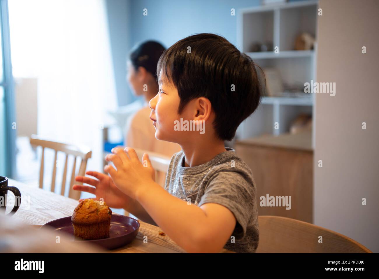 Boy eating bread Stock Photo