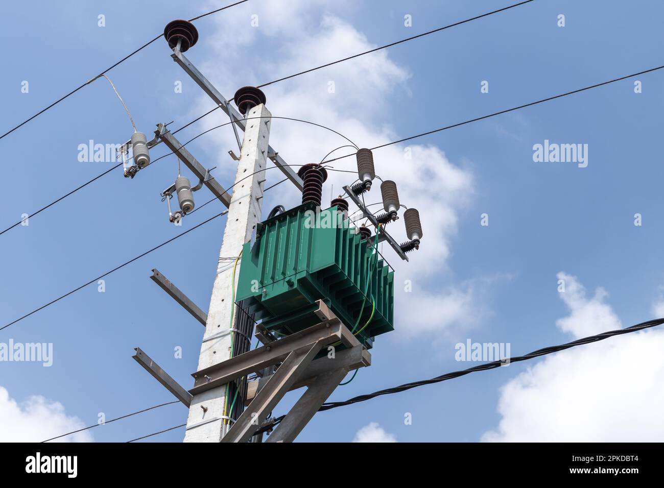 High voltage power line details mounted on a concrete pole. High