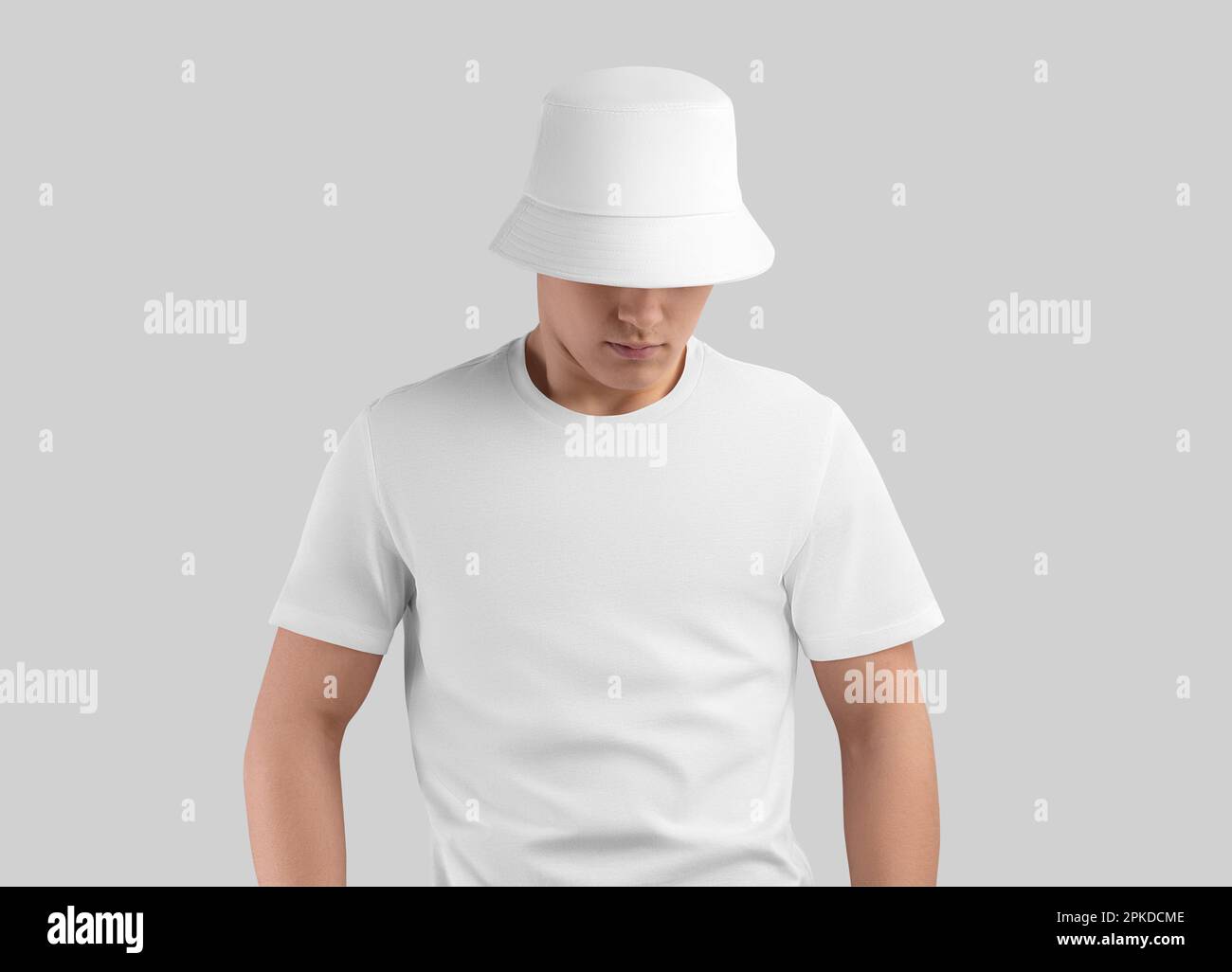 Mockup of a white panama on a cute guy in a t-shirt, isolated on the background. Headwear template with fields for design, print, branding, advertisin Stock Photo