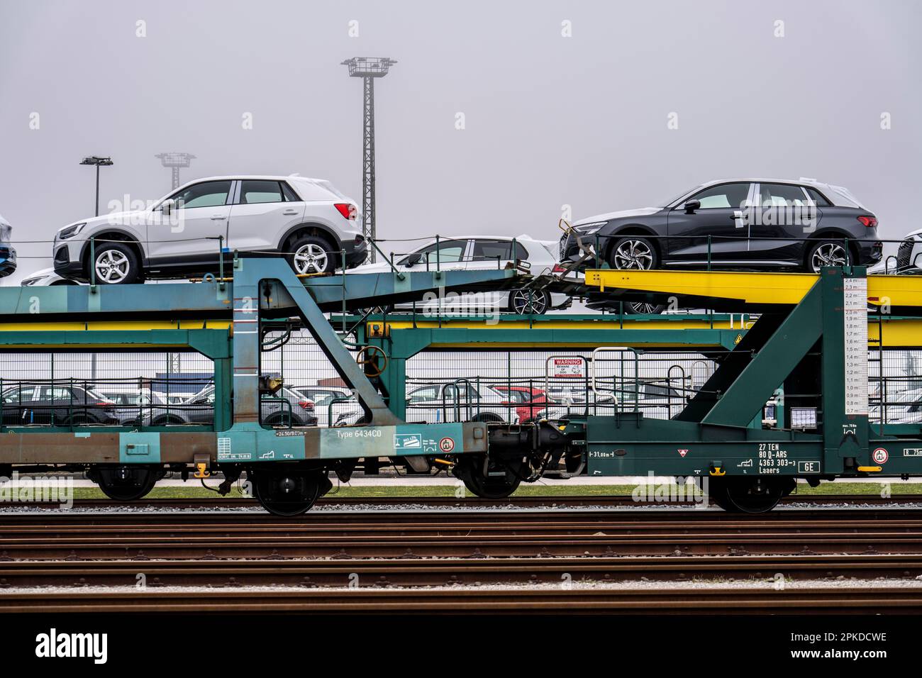 Freight train, car carrier brings new cars from Germany, for export by