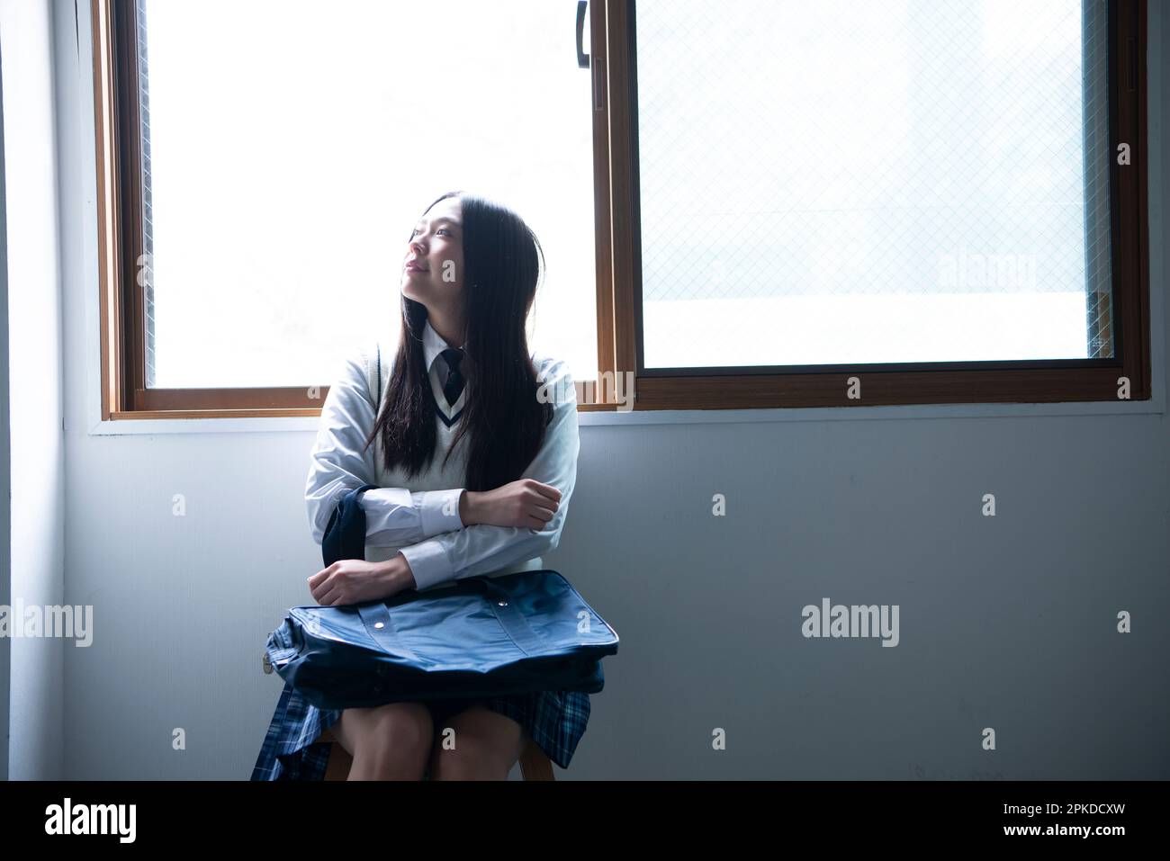 Girl sitting in a classroom hi-res stock photography and images - Alamy