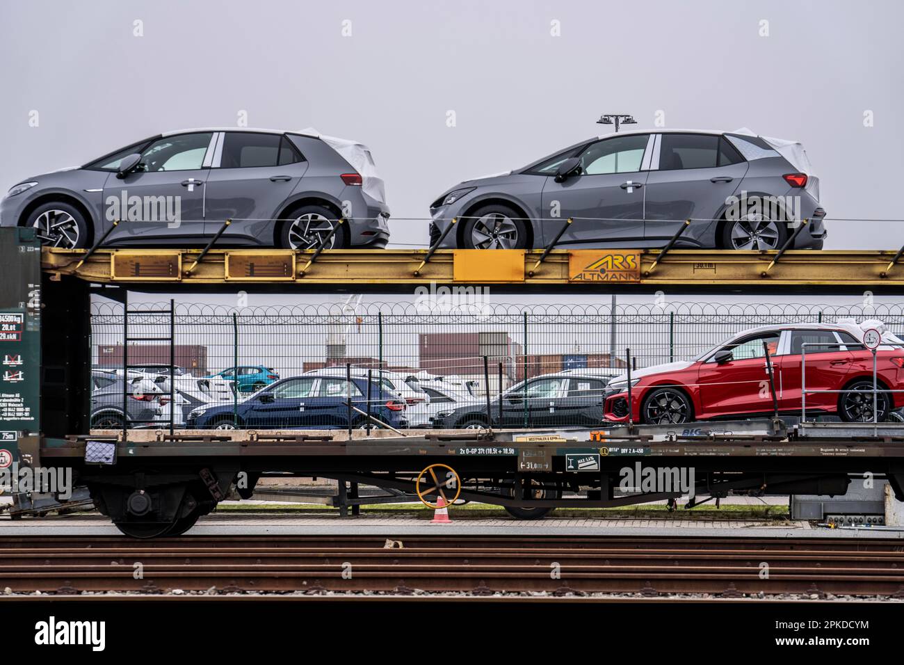Freight train, car carrier brings new cars from Germany, for export by
