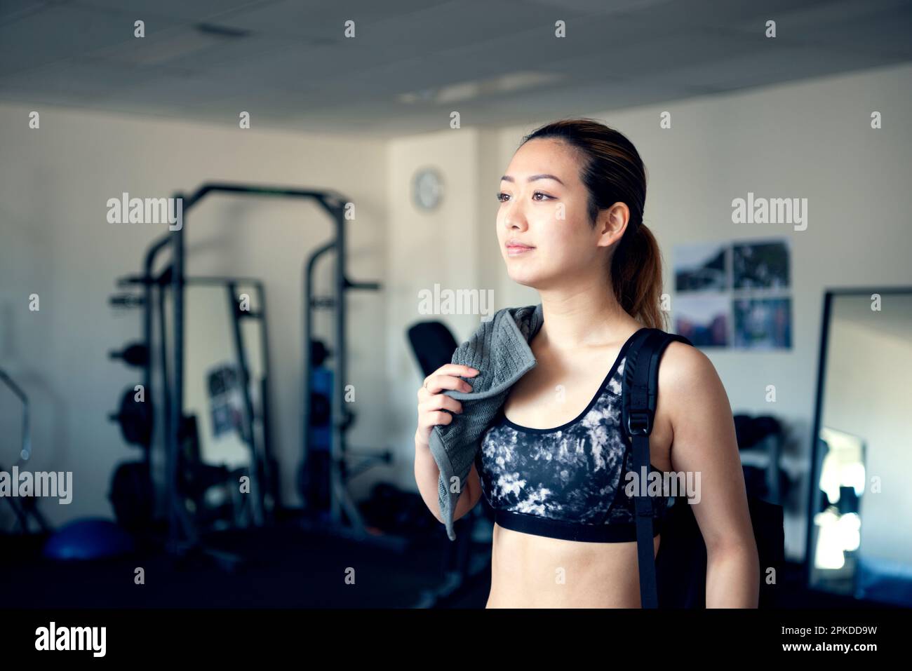 Woman wiping sweat at the gym Stock Photo Alamy