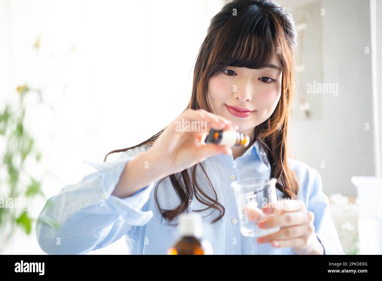 Woman making lotion aroma hi-res stock photography and images - Alamy