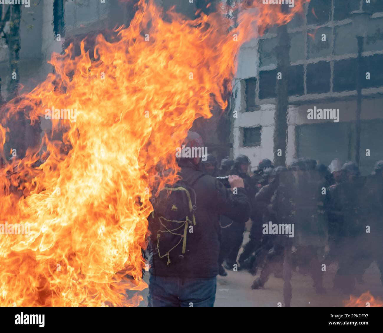 Paris, France, 06th April, 2023. Fire with CRS riot police during pension reform march - Jacques Julien/Alamy Live News Stock Photo