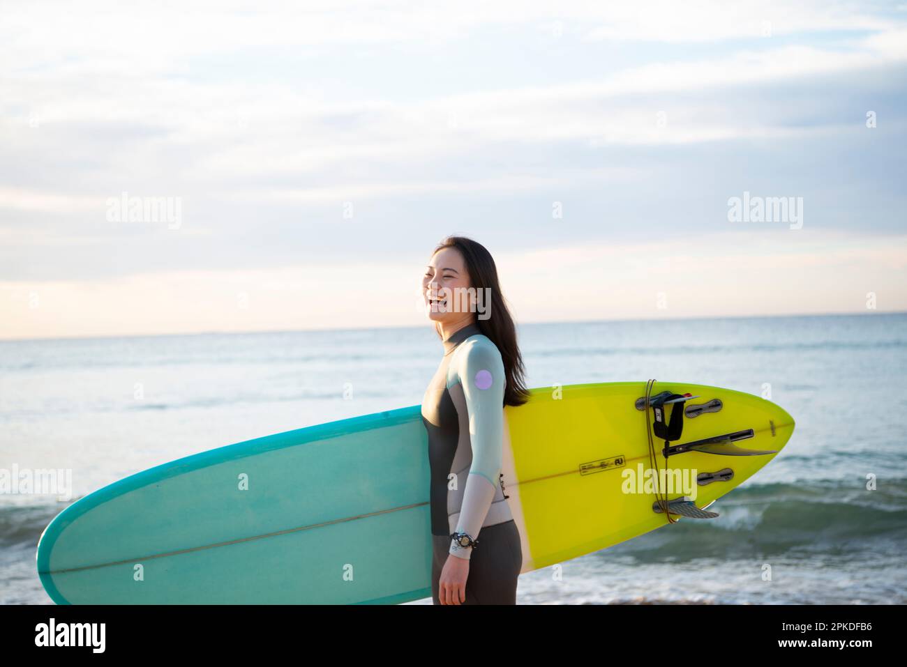Smiling surfer holding surfboard hi-res stock photography and images ...