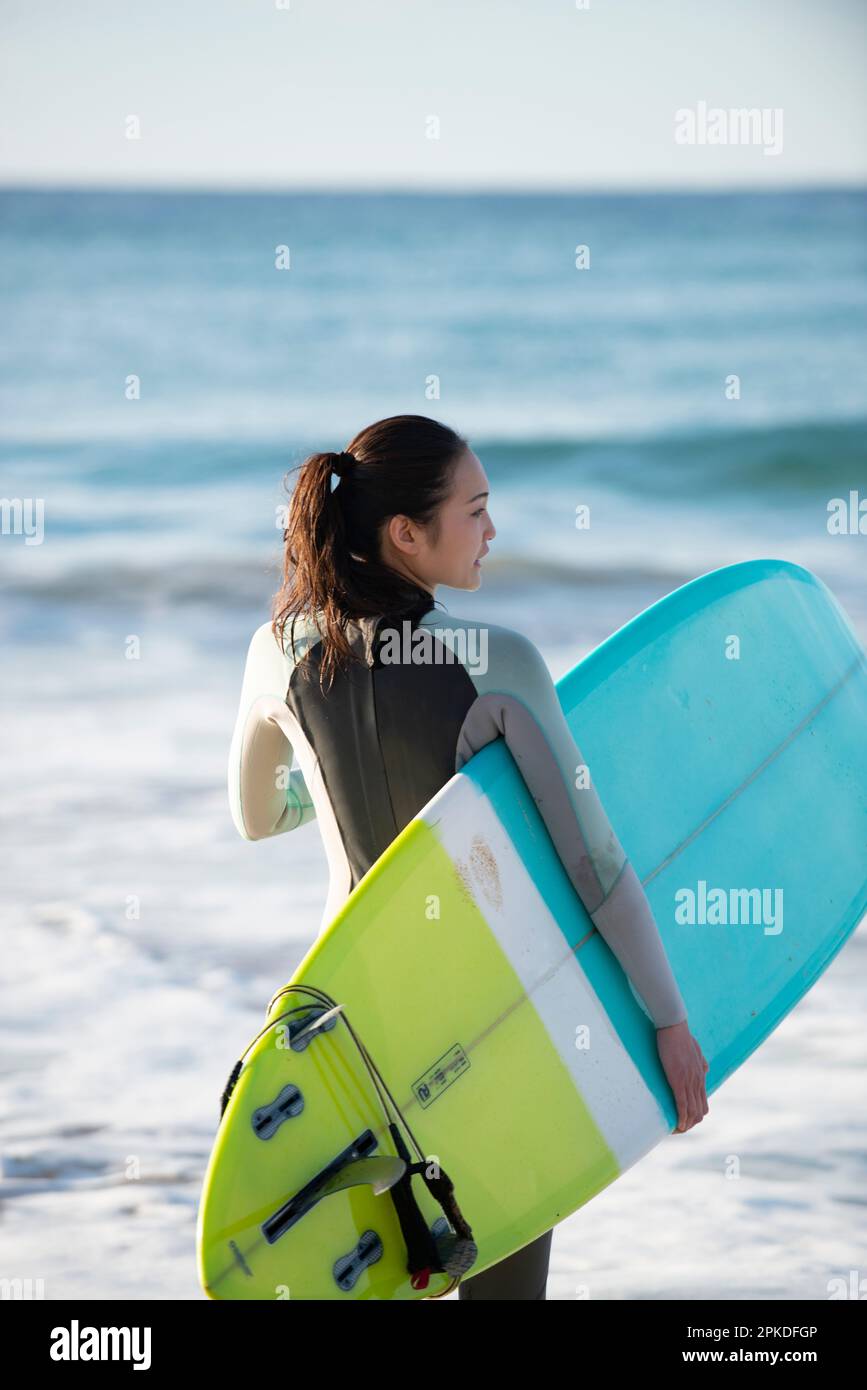 Asian woman surfer wetsuit hi-res stock photography and images - Alamy
