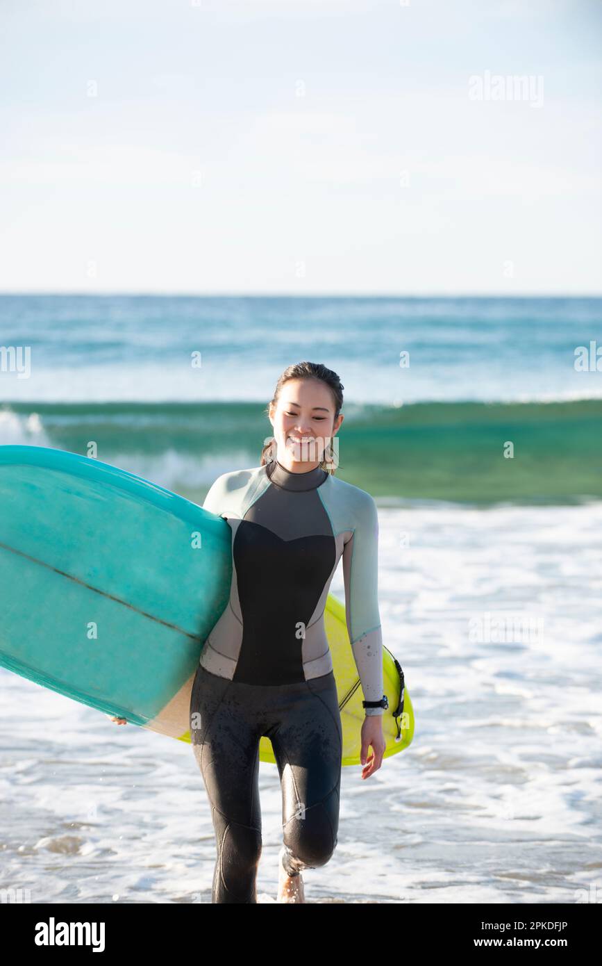 Asian woman surfer wetsuit hi-res stock photography and images - Alamy