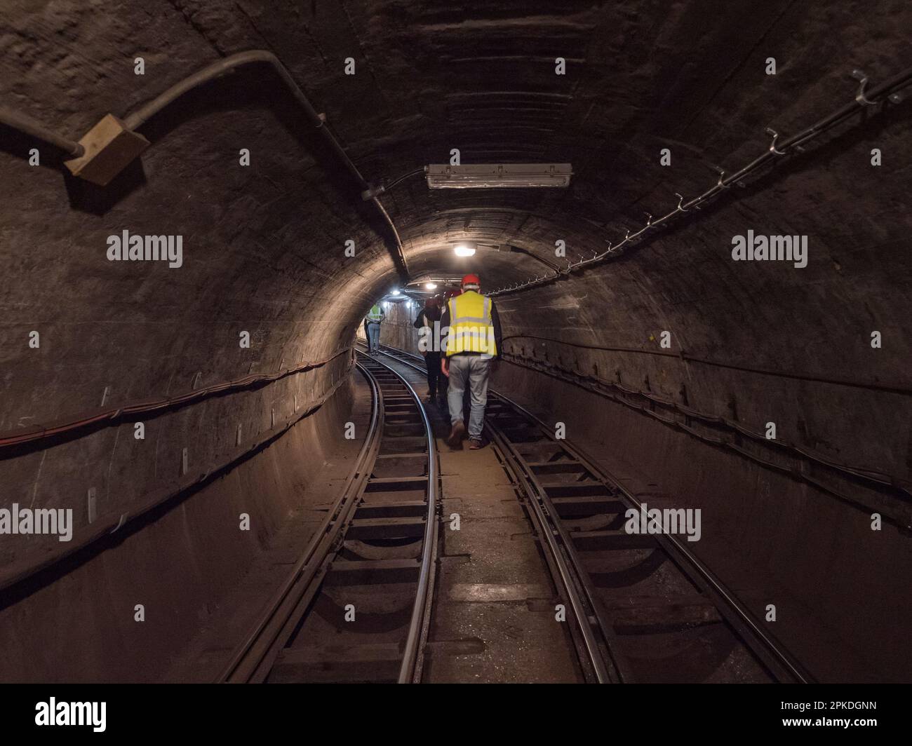 General view of a tour group inside a tunnel of Mail Rail, the former