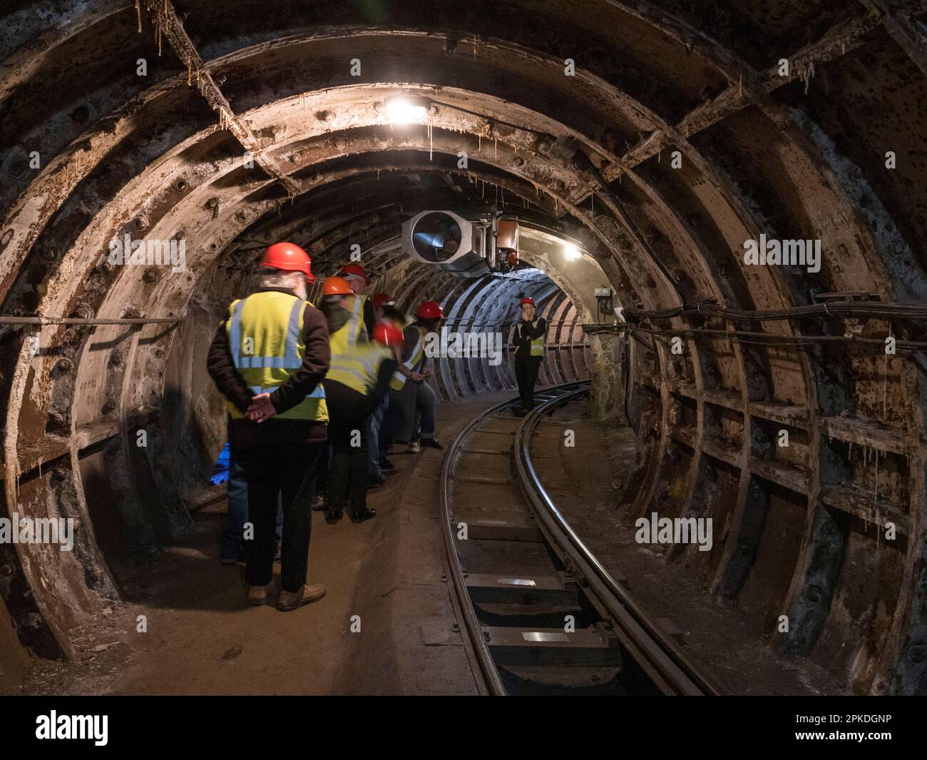 General view of a tour group inside a tunnel of Mail Rail, the former