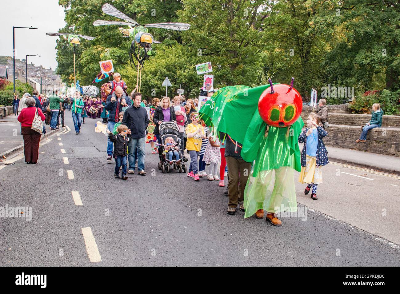 Giant caterpillar roams the streets of the market town of Skipton---Puppet Festival 2015. Stock Photo
