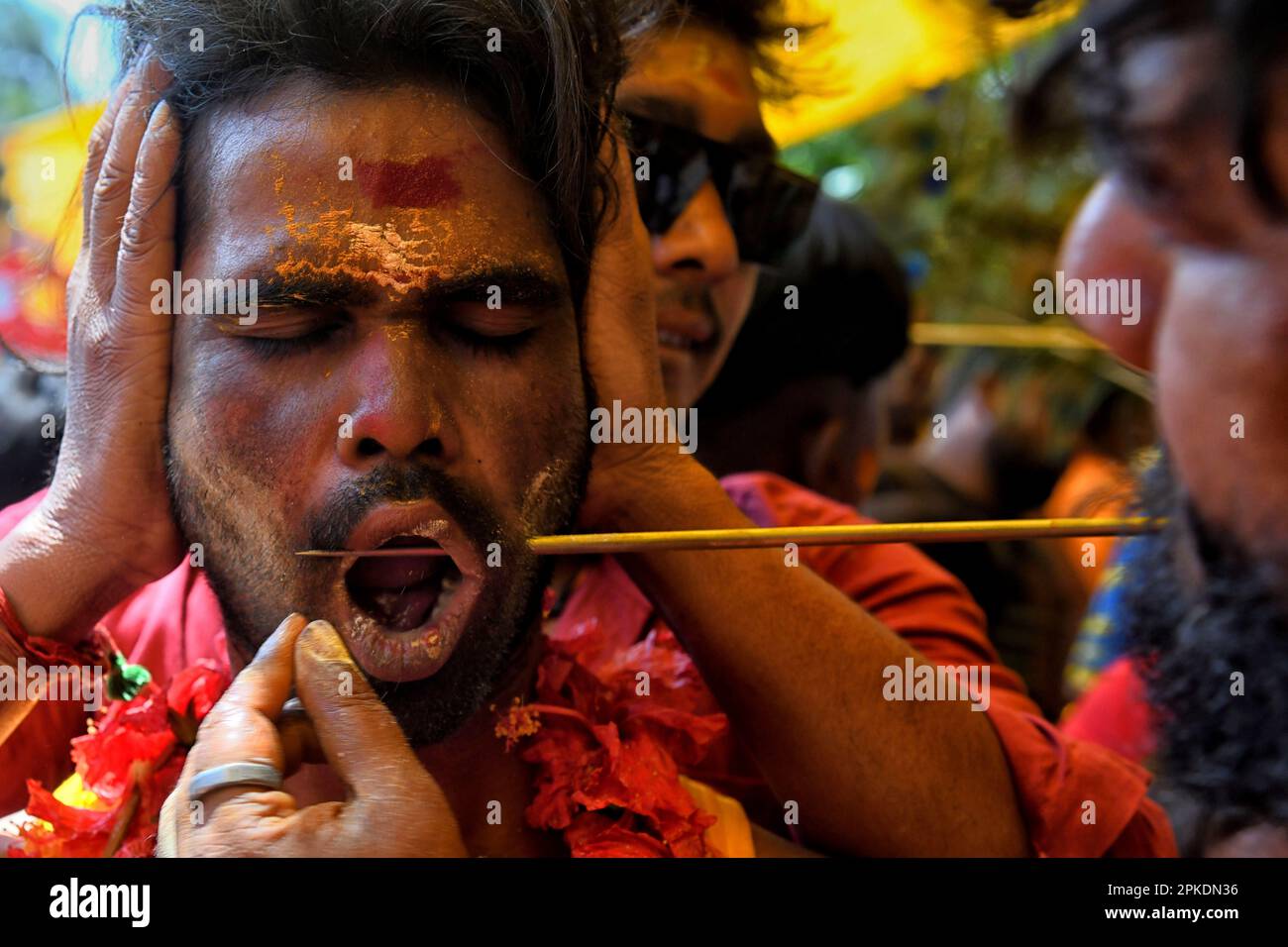 Bandel, India. 06th Apr, 2023. A devotee seen getting pierced by a vel ...