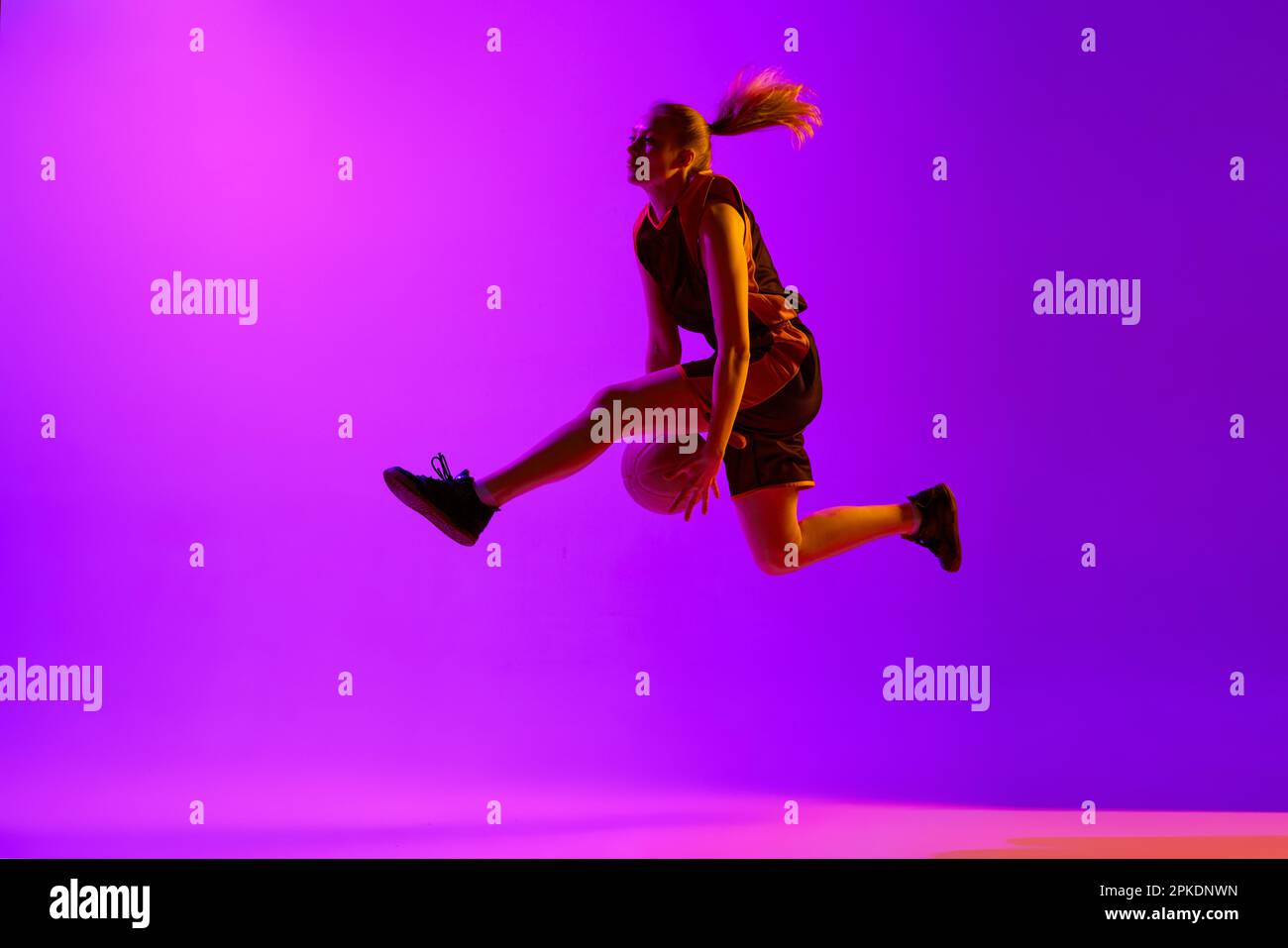 Young girl, female basketball player in motion, training, playing