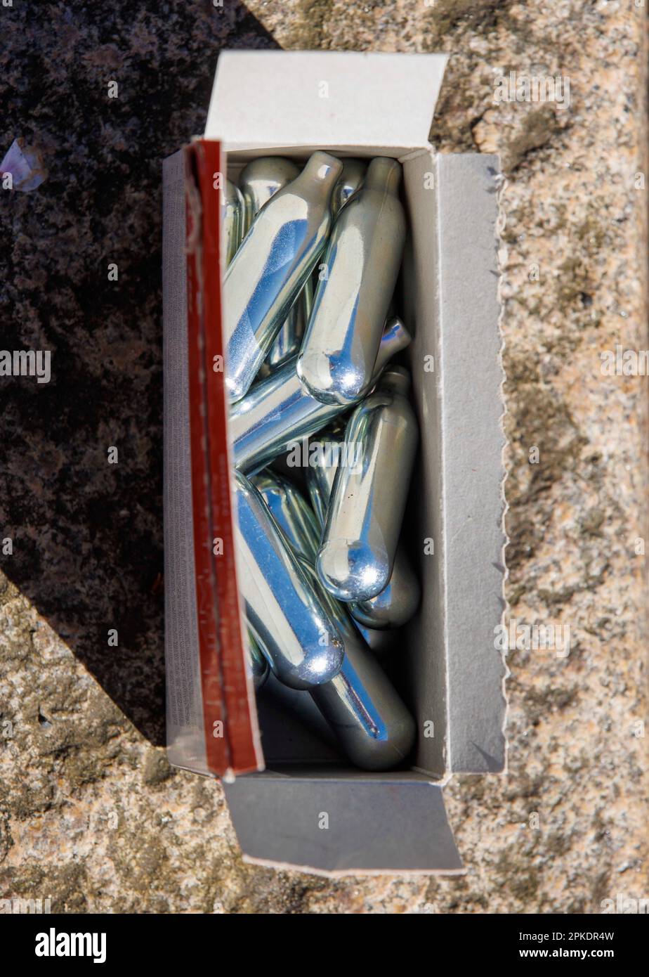 London uk 7th apr 2023 canisters of nitrous oxide in a street in