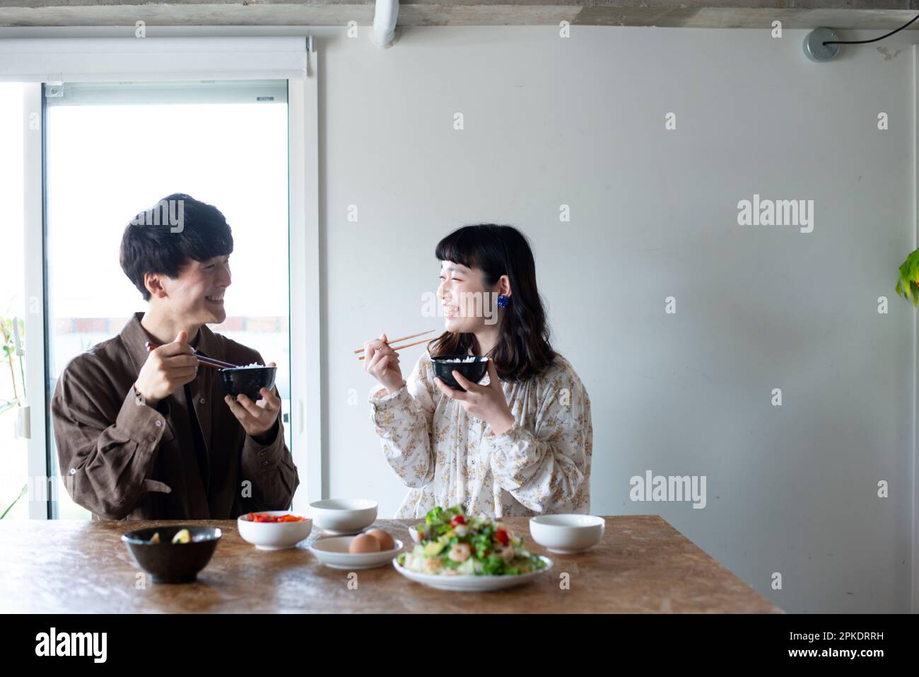 Couple having dinner at home Stock Photo