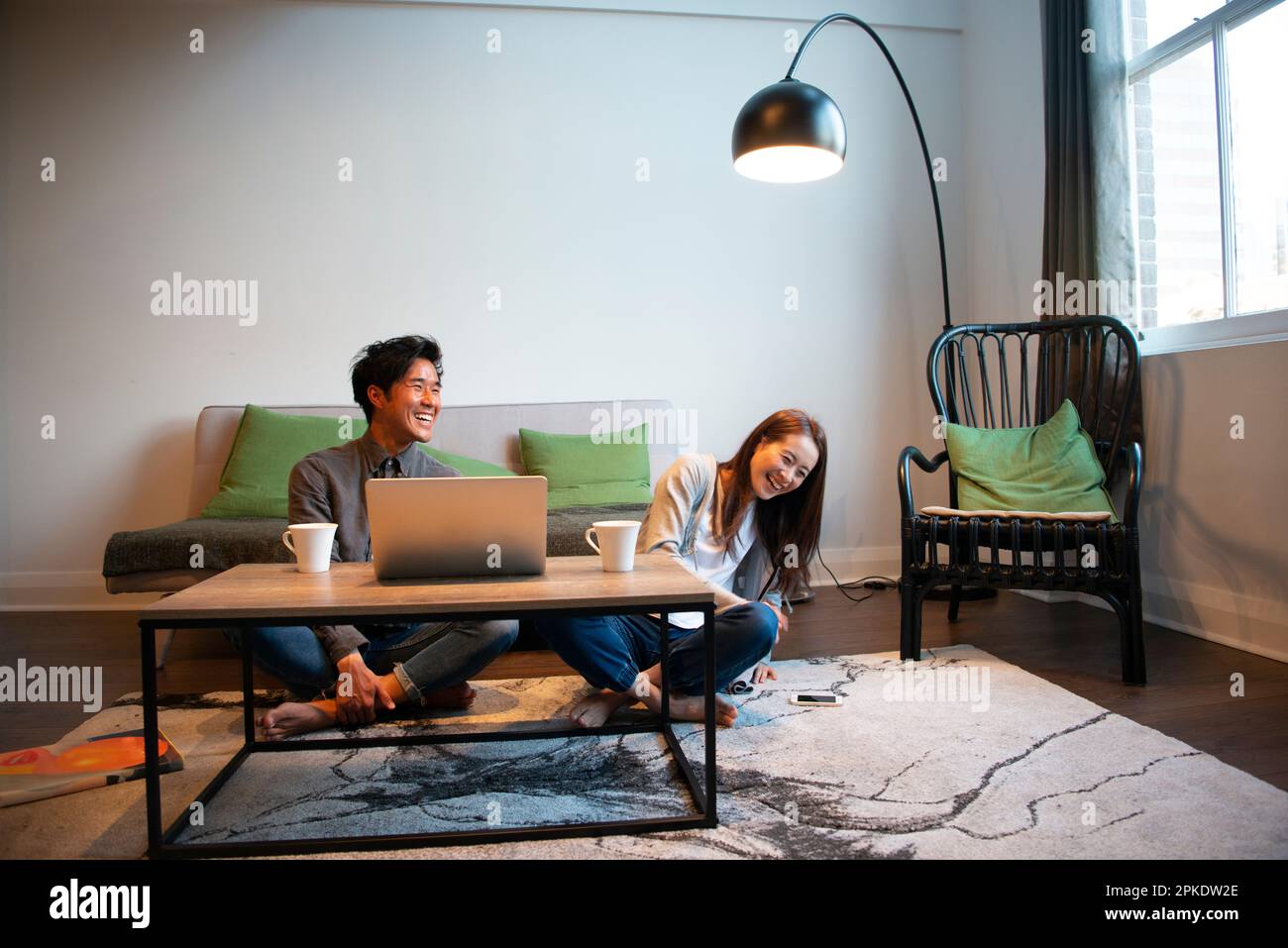 Couple relaxing in the living room Stock Photo