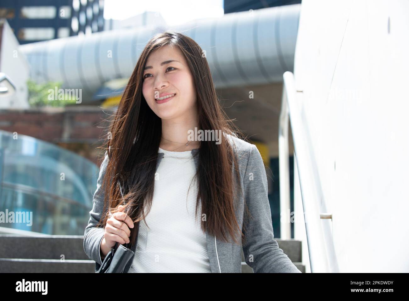 Asian woman in business suit smiling hi-res stock photography and ...