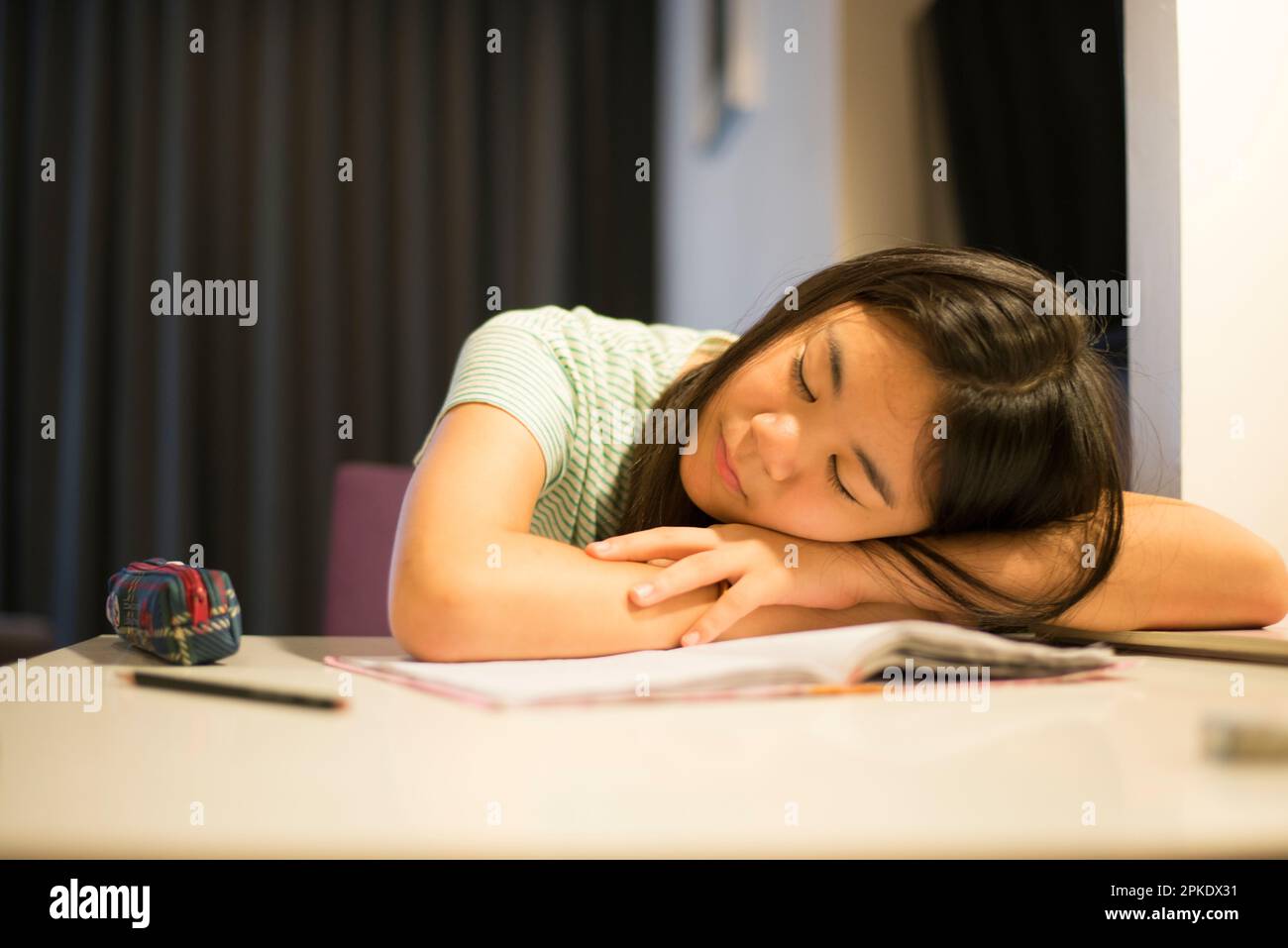 Girl asleep at her desk Stock Photo - Alamy