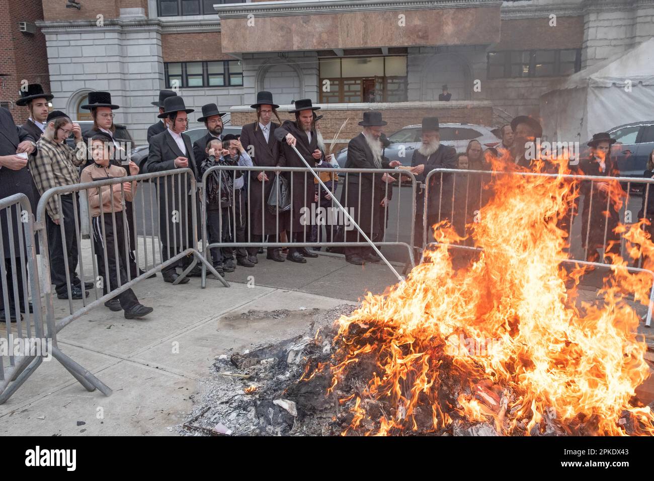 On the morning before Passover a family prays together at a bonfire