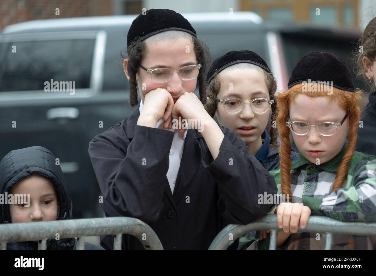 4 orthodox Jewish boys watch the annual pre Passover burning of the last remaining bread products. In Brooklyn, New York City. Stock Photo