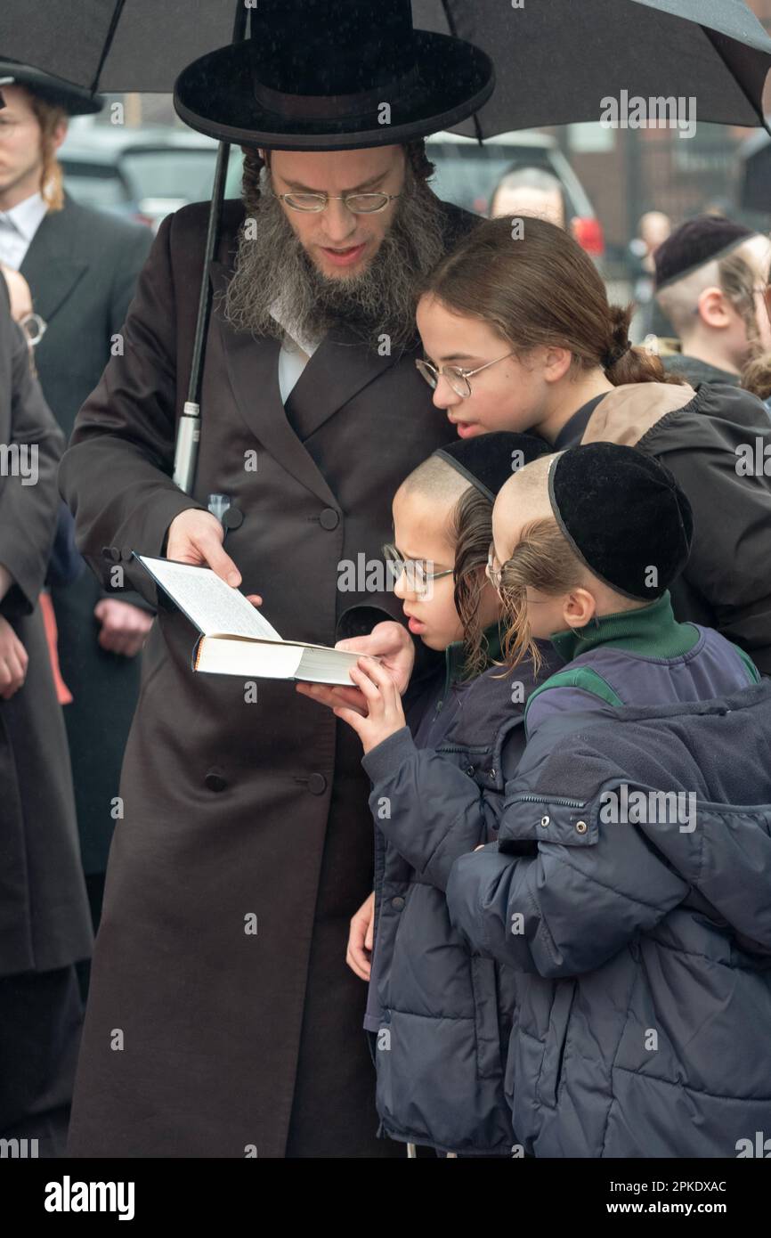 On the morning before Passover a family prays together at a bonfire