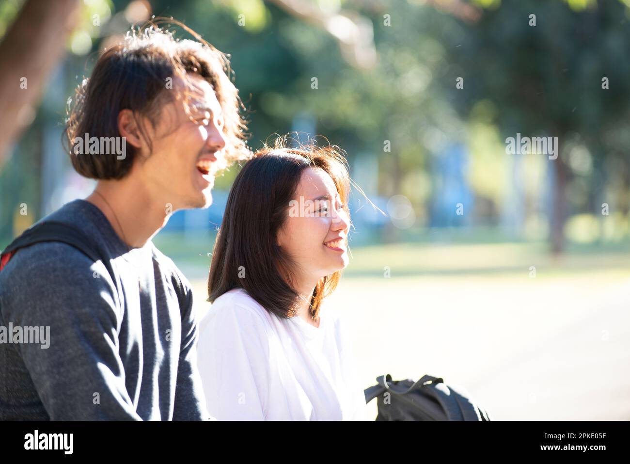 Man and woman laughing in a row Stock Photo - Alamy