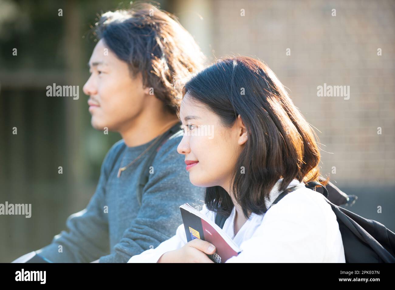 Profile of man and woman looking into the distance Stock Photo