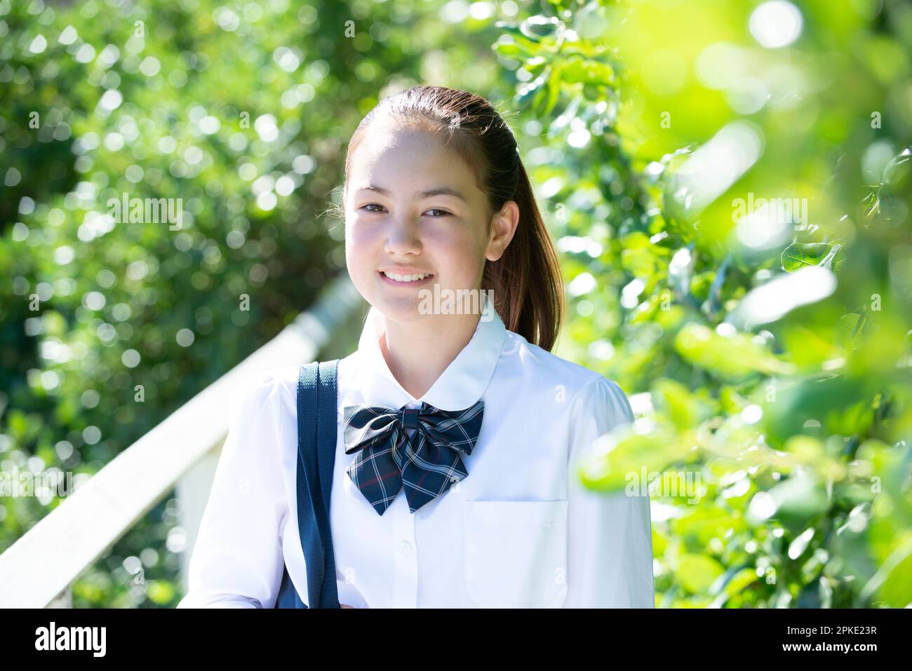 Female student in school uniform smiling Stock Photo - Alamy