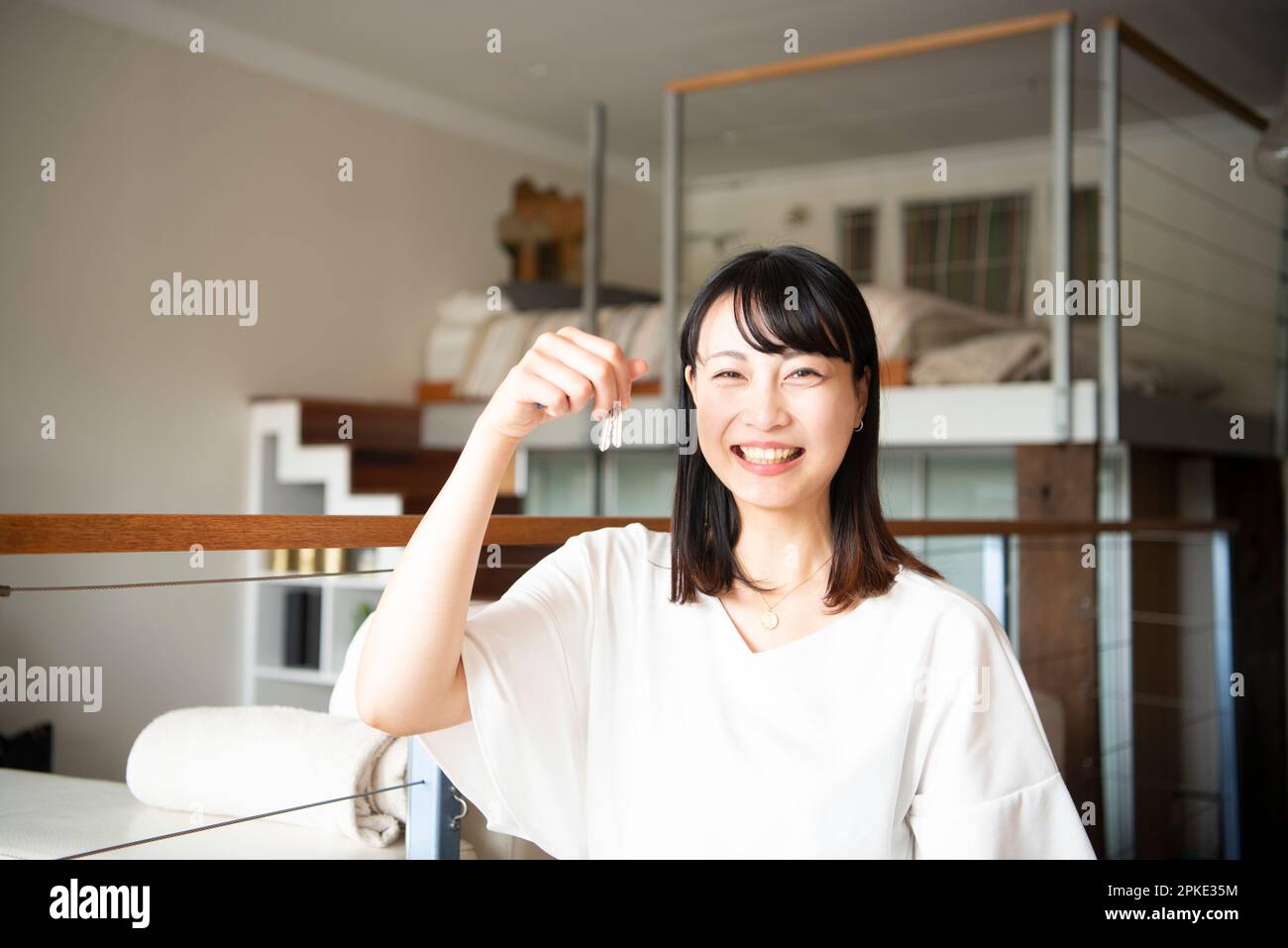 Woman laughing with keys Stock Photo