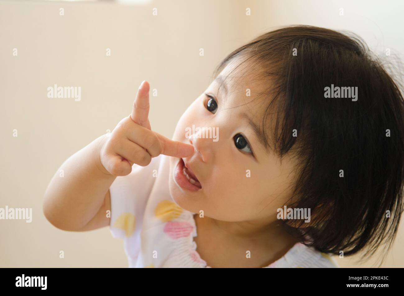 Girl pointing Stock Photo