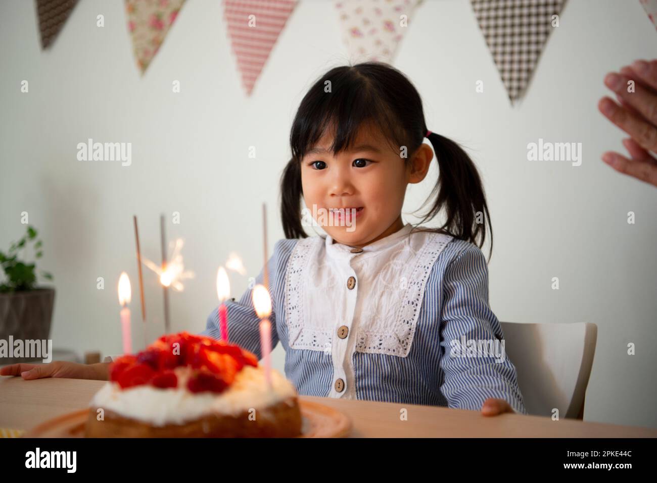 Girl in front of the cake Stock Photo