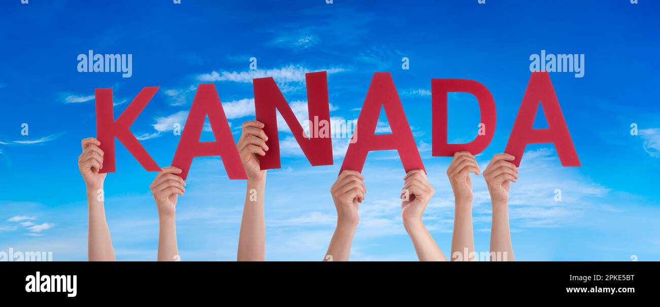 People Hands Building Word Kanada Means Canada, Blue Sky Stock Photo