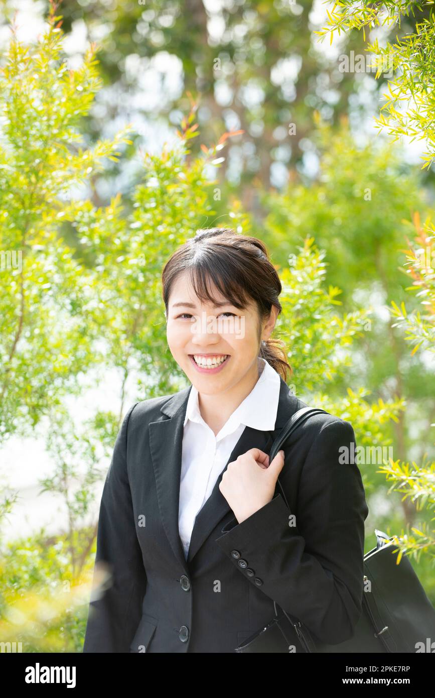 Woman in green suit hi-res stock photography and images - Alamy